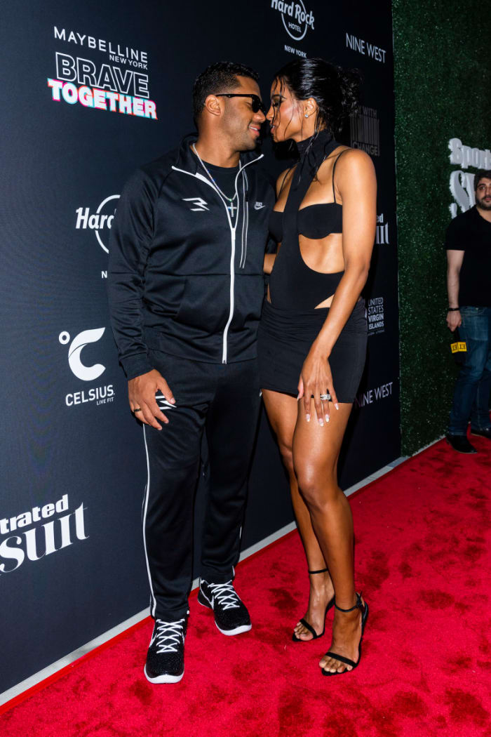 Cover model Ciara and husband Russell Wilson share a sweet moment on the red carpet.